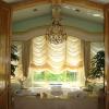 mount-bath-tub-with-side-wall-bath-tub-faucet-brushed-nickel-brushed-gold-chandelier-lamp-cream-fabric-curtain-cream-translucent-fabric-curtain-cream-stain-wall-varnished-wood-door-varnished-wood-ba
